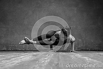 Young beautiful yoga female posing in studio Stock Photo