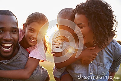 Young black couple enjoying family time with children Stock Photo