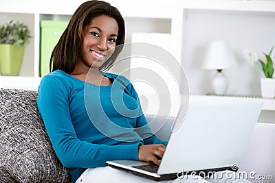 Young black girl with laptop computer Stock Photo