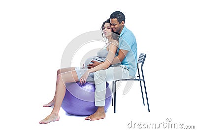 A young black man helps his white wife with birth pain with a ball. Partnered birth, partnered delivery. Isolated white Stock Photo