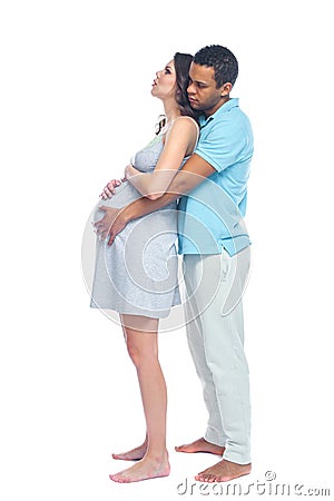 A young black man helps his white wife with birth pain with a ball. Partnered birth, partnered delivery. Isolated white Stock Photo