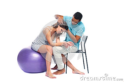 A young black man helps his white wife with birth pain with a ball. Partnered birth, partnered delivery. Isolated white Stock Photo
