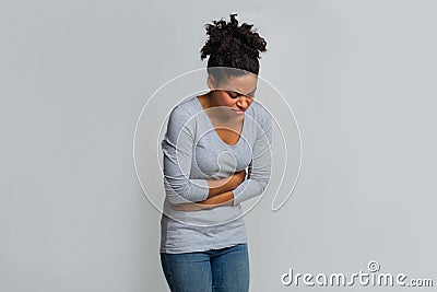 Young black woman having menstrual abdominal pain Stock Photo