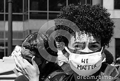 A Young Black Woman Wears a Mask With the Words `We Matter` Written on It Editorial Stock Photo