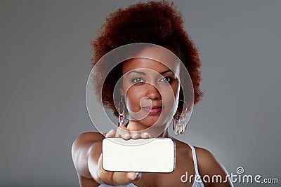 Young Blank woman holding up a blank smartphone Stock Photo