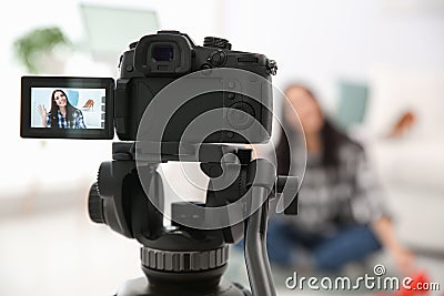 Young blogger recording video, focus on camera screen Stock Photo