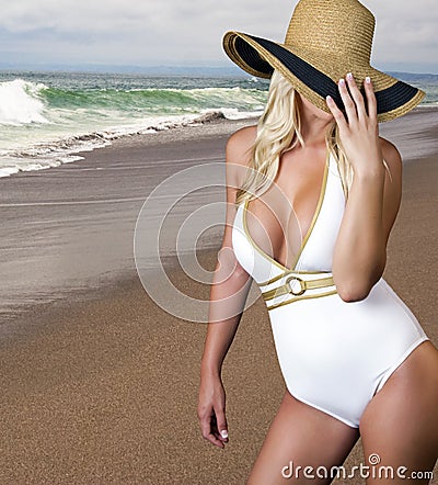 Young blond female on the beach Stock Photo