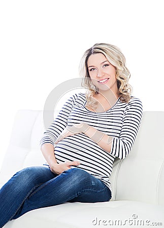 Young blond pregnant woman in a striped shirt Stock Photo