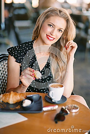 Beautiful woman sitting in cafe. Stock Photo