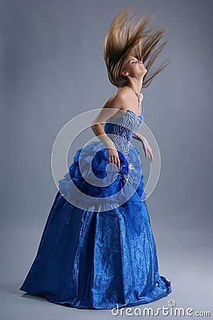 A young blond woman in blue wedding dress Stock Photo