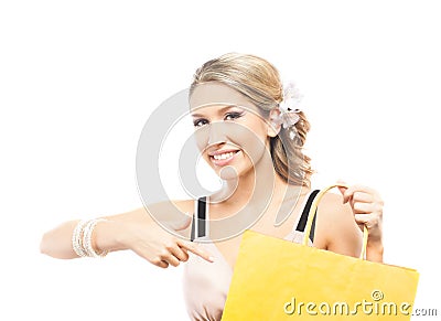 A young blond woman holding a yellow shopping bag Stock Photo