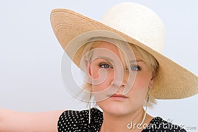 Somber Woman in Hat Stock Photo