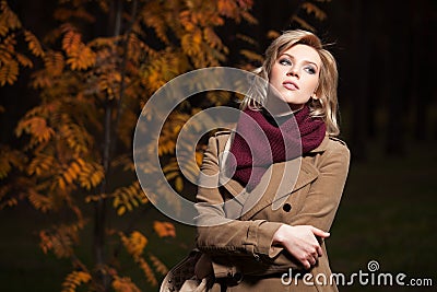 Young blond woman in a night autumn forest Stock Photo