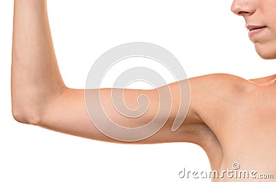 Young blond woman showing flabby arm Stock Photo