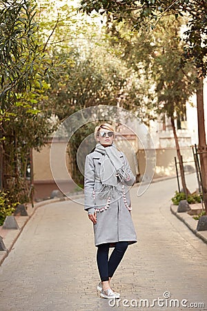 Young blond woman with sunglases on the street Stock Photo