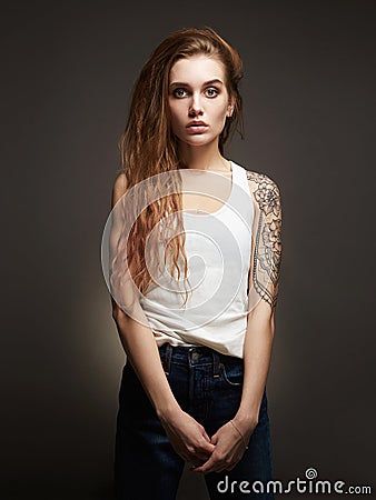 Young blond woman with tattoo Stock Photo