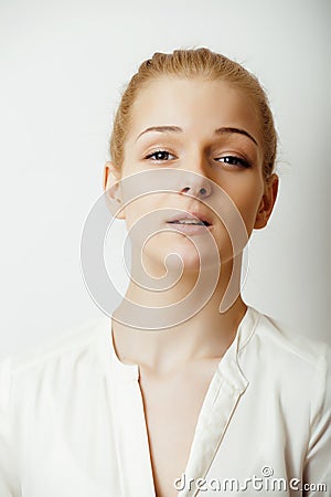 Young blond woman on white backgroung gesture thumbs up, isolated emotional posing close up, lifestyle people concept Stock Photo