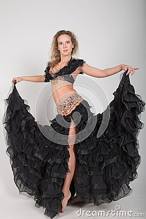 Young blonde in a black stage outfits Stock Photo