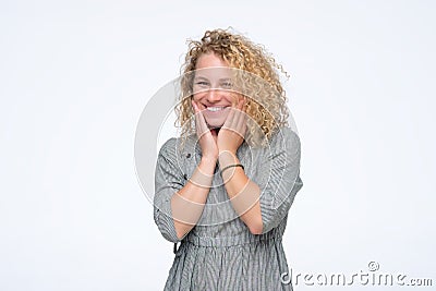 Young blonde curly laughing woman having positive mood. Stock Photo