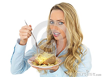 Young Blonde Haired Woman Eating a Baked Potato with Cheese Stock Photo