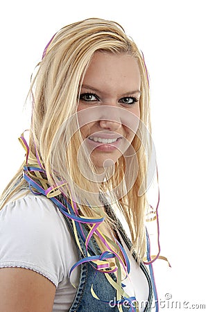 Young blonde woman with garlands around her nek is looking into the camera Stock Photo