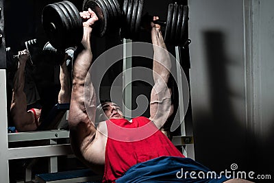 Young bodybuilder doing bench press for chest Stock Photo