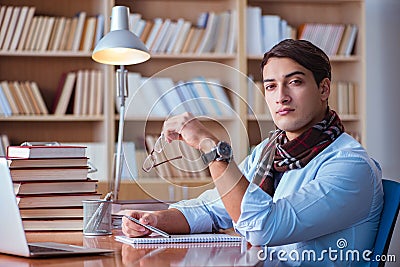 The young book writer writing in library Stock Photo