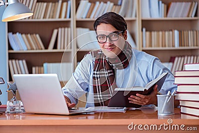 The young book writer writing in library Stock Photo