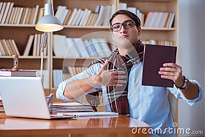 The young book writer writing in library Stock Photo