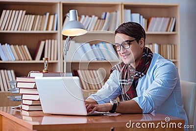 The young book writer writing in library Stock Photo