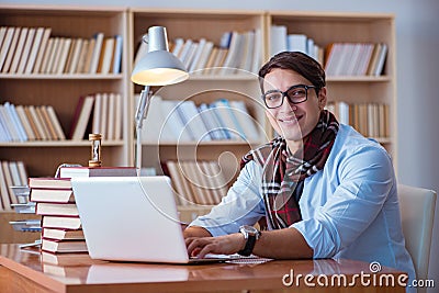 The young book writer writing in library Stock Photo