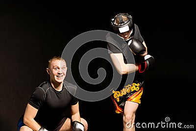 Young boxer ducking under his opponents punch Stock Photo