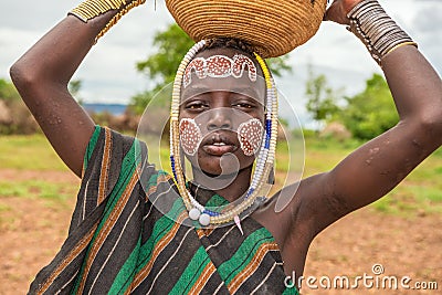 Young boy from the african tribe Mursi, Ethiopia Editorial Stock Photo