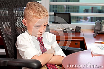 Young Boy in Business Office Stock Photo