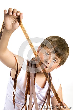 Young boy with celluloid movie Stock Photo