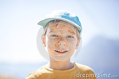 Young boy with with dirty smudges on face after playing outdoors Stock Photo