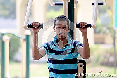 A young boy doing exercise in public park Delhi in India. Editorial Stock Photo