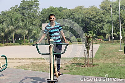 A young boy doing exercise in public park Delhi in India. Editorial Stock Photo