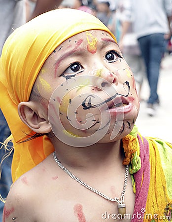 A young boy eating in Festival of Cows( Gaijatra) Editorial Stock Photo