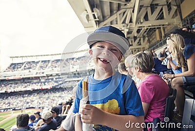 Young boy enjoying a day watching a professional baseball game Stock Photo