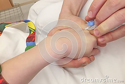 Young boy getting glucose injection Stock Photo