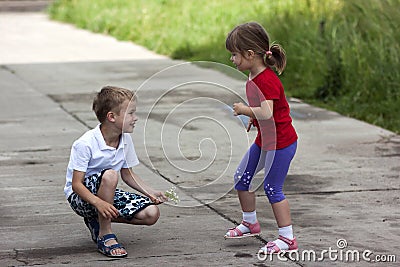 Young boy and girl brother and sister together laughing happily Stock Photo