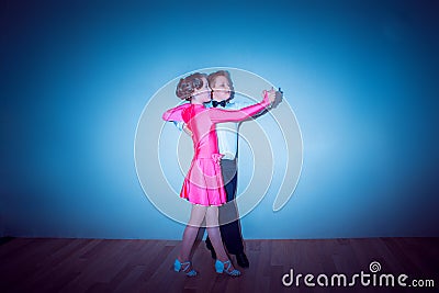 The young boy and girl posing at dance studio Stock Photo