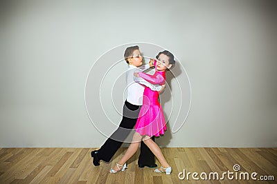 The young boy and girl posing at dance studio Stock Photo