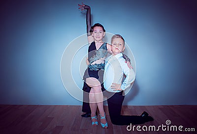 The young boy and girl posing at dance studio Stock Photo