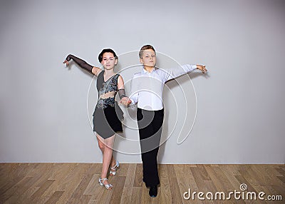 The young boy and girl posing at dance studio Stock Photo