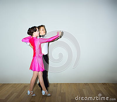 The young boy and girl posing at dance studio Stock Photo