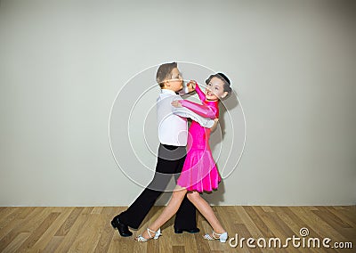 The young boy and girl posing at dance studio Stock Photo