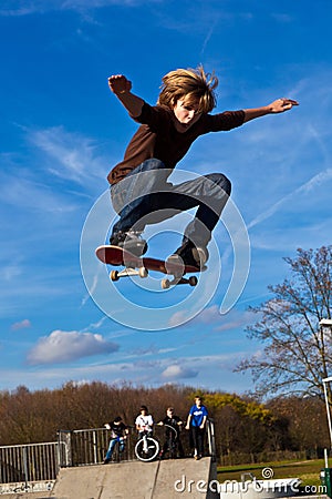 Young boy going airborne with his skateboard Stock Photo