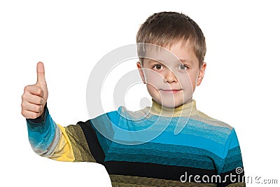 Young boy holds his thumb up Stock Photo